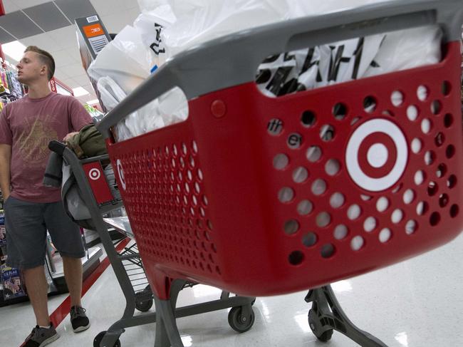 In this Aug. 21, 2015, photo, Boston College students Alli Urbon, left, and Eddie Dols shop at the CityTarget store in Boston. The Commerce Department releases retail sales data for September on Wednesday, Oct. 14, 2015. (AP Photo/Michael Dwyer)