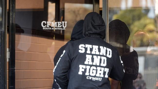 CFMEU members arrive at the South Australian headquarters ahead of a meeting. Picture: Brenton Edwards