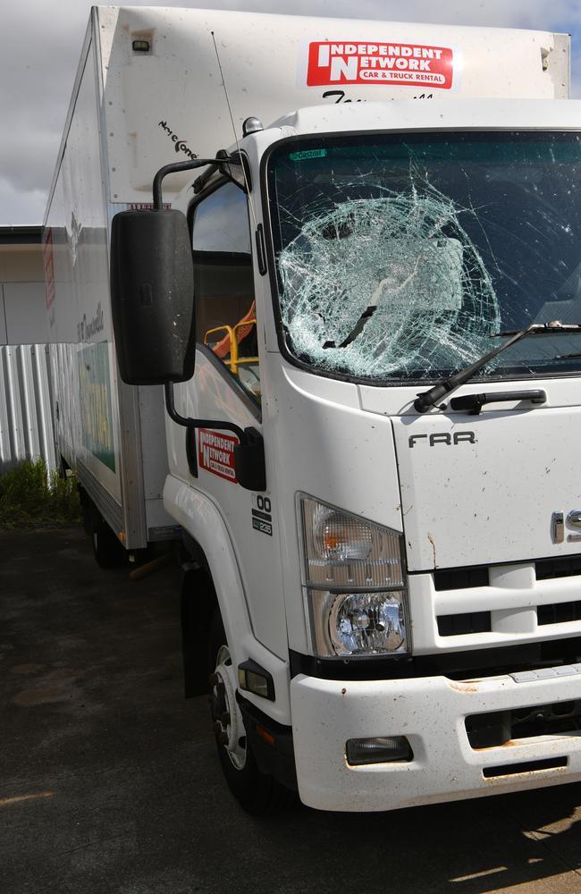 Debbie Thompson at Independent Network in Garbutt with vehicles damaged by a vandal. Picture: Evan Morgan