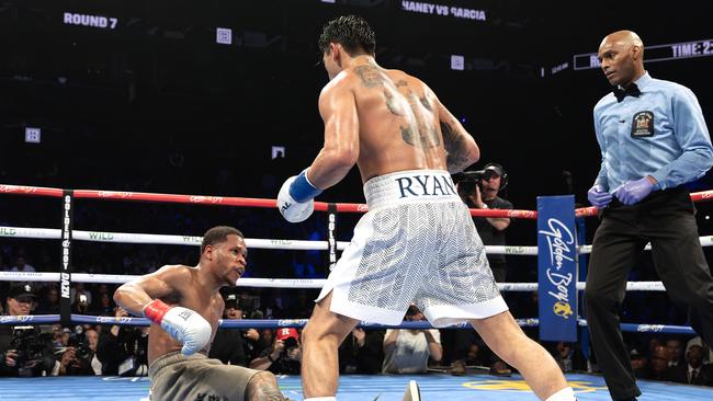 Garcia stands over Haney. Photo by Al Bello/Getty Images