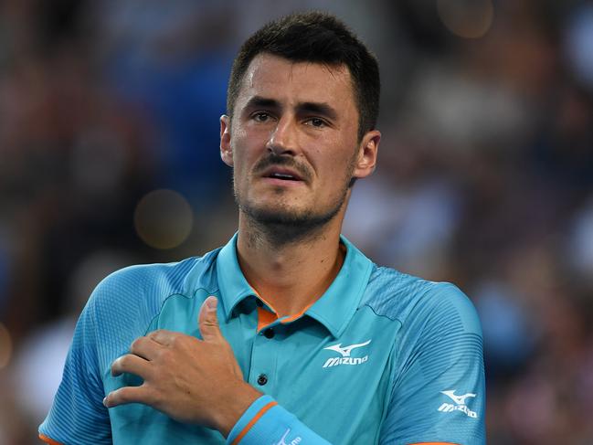 Bernard Tomic of Australia in action against Marin Cilic of Croatia during day one of the Australian Open tennis tournament in Melbourne, Monday, January 14, 2019. (AAP Image/Lukas Coch) NO ARCHIVING, EDITORIAL USE ONLY