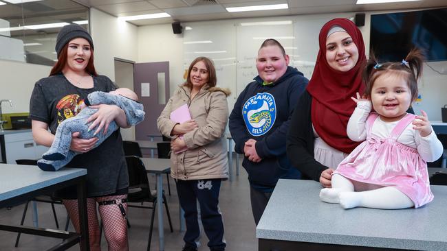 Students Jasmyne Bates, 19, and Aries Rao-Bates, 3 months, Xanadu Sales, 21, Joshua Harding, 17, and Fatima Al Nuaimy, 23, with Razan Wahab, 11 Months, at Warakirri College. Picture: Justin Lloyd.