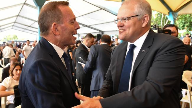 Tony Abbott and Scott Morrison at Good Friday Easter services. Picture: AAP. 