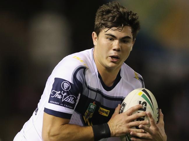 SYDNEY, AUSTRALIA - AUGUST 18:  Jake Clifford of the Cowboys  runs the ball during the round 23 NRL match between the Cronulla Sharks and the North Queensland Cowboys at Southern Cross Group Stadium on August 18, 2018 in Sydney, Australia.  (Photo by Mark Evans/Getty Images)