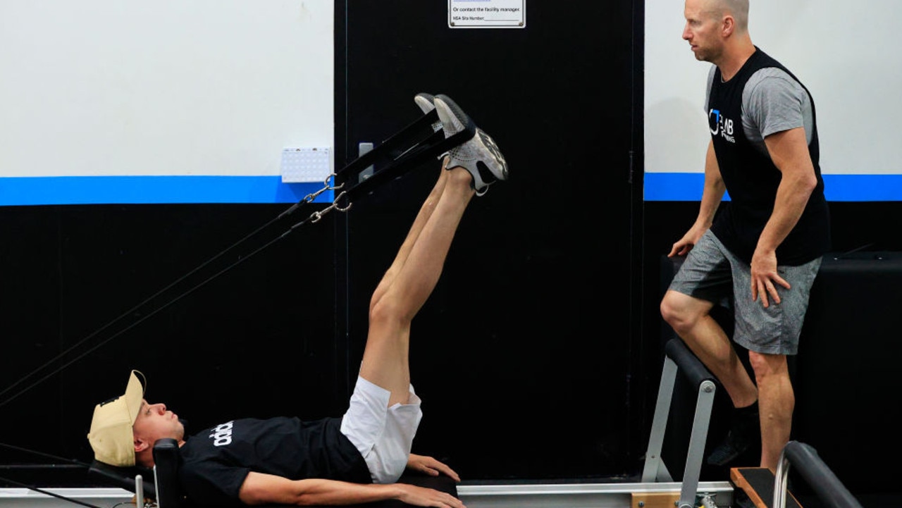 SYDNEY, AUSTRALIA - SEPTEMBER 29: Jockey Andrew Adkins on a pilates reformer during his gym session with Trent Langlands at E-Lab Training Waverley, on September 29, 2020 in Sydney, Australia. Adkins continues his recovery to racing after falling from Hot N' Hazy at Rosehill on 25th July this year. (Photo by Mark Evans/Getty Images)