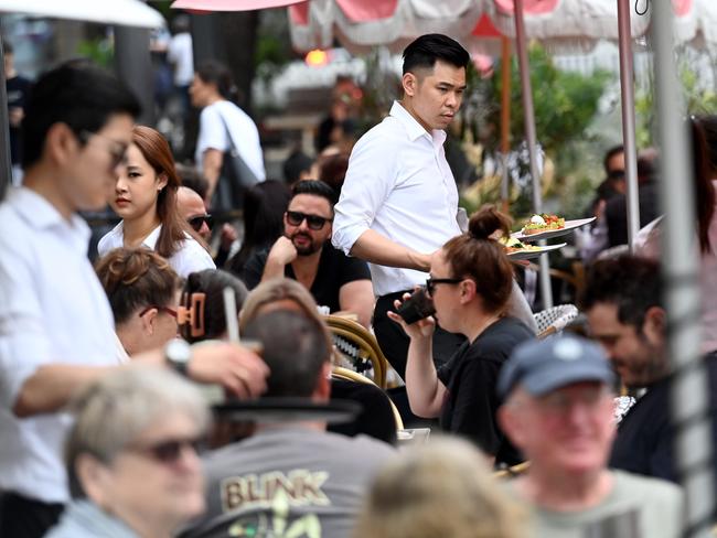 SYDNEY, AUSTRALIA - NewsWire Photos OCTOBER 22, 2022: Casual staff work the tables at a cafe in the Rocks in Sydney.Picture: NCA NewsWire / Jeremy Piper