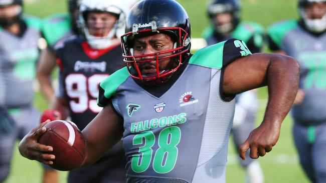 Hare Coakley runs the ball in the NQ Gridiron series match between the Cairns Falcons and the Townsville Cyclones, held at Vico Oval, Mooroobool. PICTURE: BRENDAN RADKE.