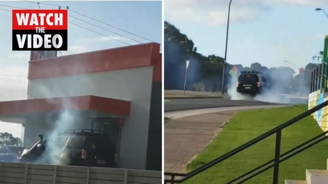 Man performs burnout at Aberfoyle Park Hungry Jack s