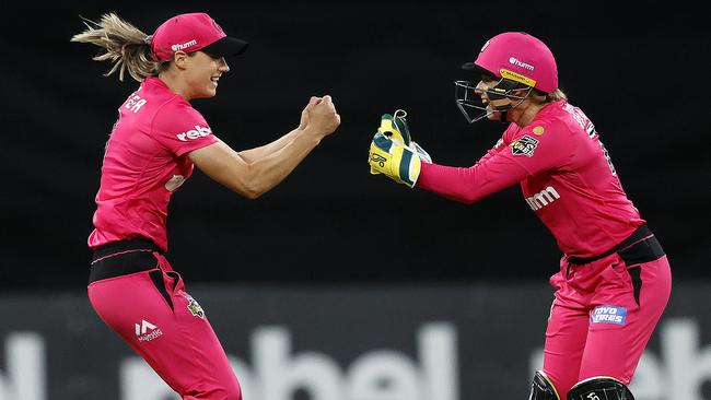 Ellyse Perry and Alyssa Healy celebrate the dismissal of the Thunder’s Sammy-Jo Johnson. Picture: Phil Hillyard