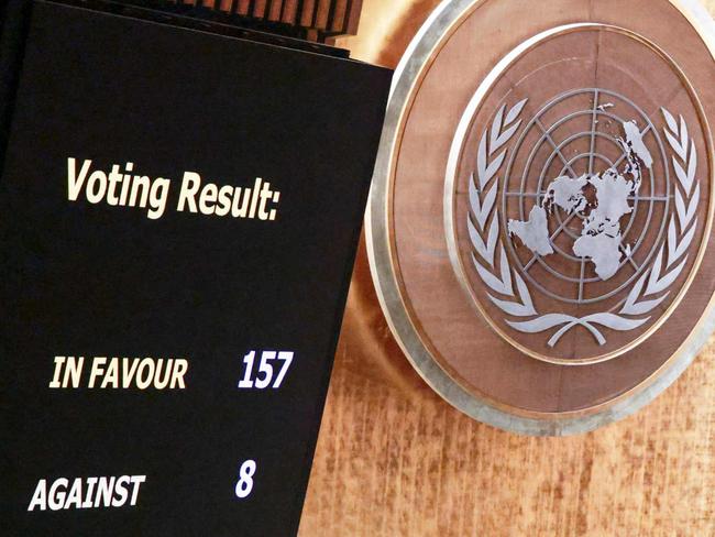 A screen shows the results of the vote on the resolution entitled "Peaceful settlement of the question of Palestine" at the General Assembly 46th plenary meeting on December 3, 2024, at the UN headquarters in New York City. (Photo by Kena Betancur / AFP)