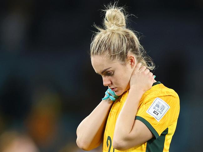 SYDNEY, AUSTRALIA - AUGUST 16: Teagan Micah and Ellie Carpenter of Australia look dejected after the team's 1-3 defeat following the FIFA Women's World Cup Australia & New Zealand 2023 Semi Final match between Australia and England at Stadium Australia on August 16, 2023 in Sydney, Australia. (Photo by Catherine Ivill/Getty Images)