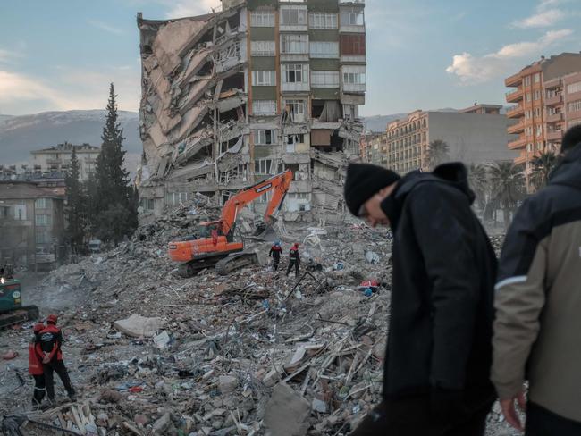 Rescuers search through the rubble of a collapsed building after the devastating earthquake in Turkey and Syria. Picture: AFP