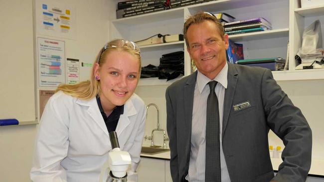 THROUGH THE LENSE: Mountain Creek State High school student Saara Silvola practising her skills with executive principal Darrin Edwards. Picture: Eden Boyd