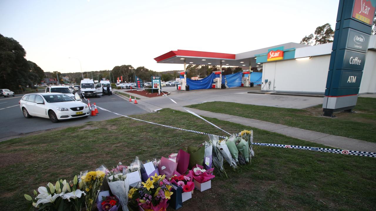Flowers laid in tribute to Zeeshan Akbar at the Caltex services station in Queanbeyan. Picture Kym Smith