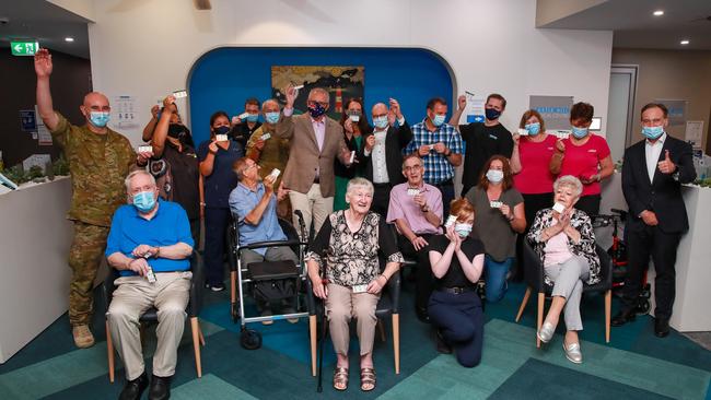 Prime Minister Scott Morrison with the first group of Australians to receive the Covid vaccine at Castle Hill Medical Centre in Sydney on Sunday. Picture: Justin Lloyd