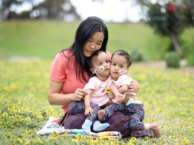 Mum Bhumchu with Nima and Dawa relaxing in the grounds of the retreat. Picture: Alex Coppel