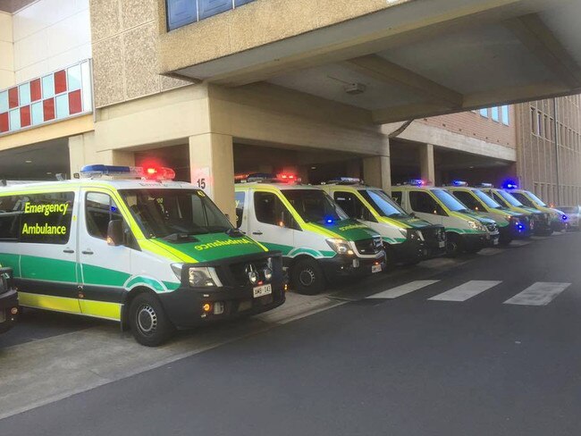 Photos of ramping at the RAH , ambulance crews turned on their lights as a silent protest when they were unable to unload patients .  Source : Ambulance Employees Association / Facebook