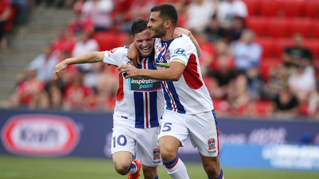 Wayne Brown and Andrew Nabbout of Newcastle celebrate.