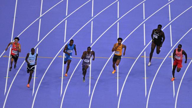 Botswana's Letsile Tebogo (second from left) taking out a semi-final ahead of Lyles (fourth from left). (Photo by Antonin THUILLIER / AFP)