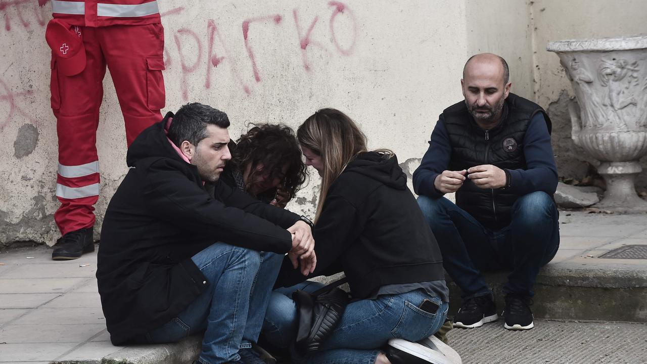 Devastated relatives they gather outside the General Hospital of Larissa after the tragedy. Picture: AFP