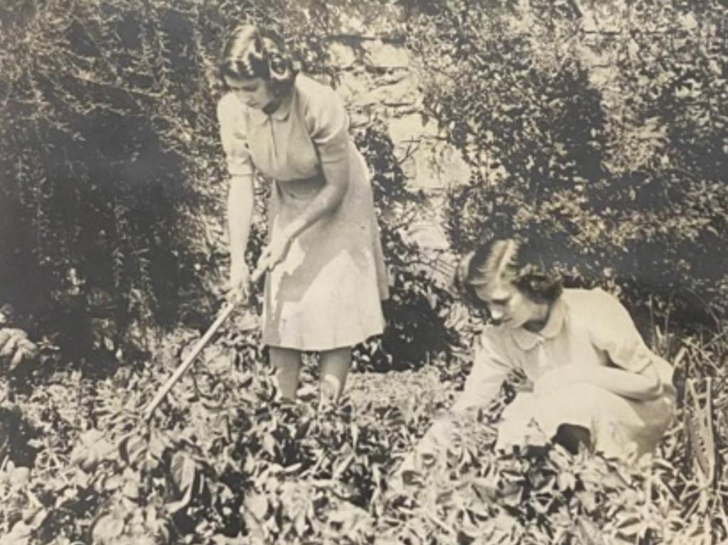 Princess Elizabeth and sister Princess Margaret gardening during their youth. Picture: Getty Images