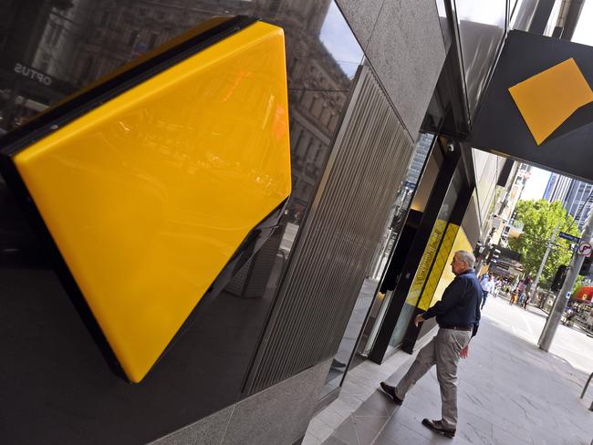 A man walks into a branch of the Commonwealth Bank in Melbourne on February 6, 2019. - Australia's largest financial firm Commonwealth Bank on February 6 said profits fell six percent in the last six months of 2018 amid a "challenging environment" for the business. (Photo by William WEST / AFP)