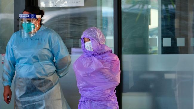 A guest at the Holiday Inn is moved to a new location as the quarantine hotel is shut down. Picture: AAP