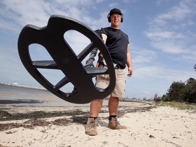 Jual Butler poses at the Wynnum foreshore, in Brisbane, Thursday, November 28, 2019. Mr Butler is a baysider who does metal detecting and recently reunited a married couple with a wedding ring after 45 years. (AAP Image/Jono Searle)