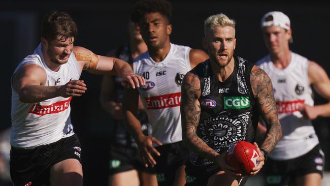 Jeremy Howe gets clear of teammate Rupert Wills at Collingwood training. Picture: Michael DodgeAAP