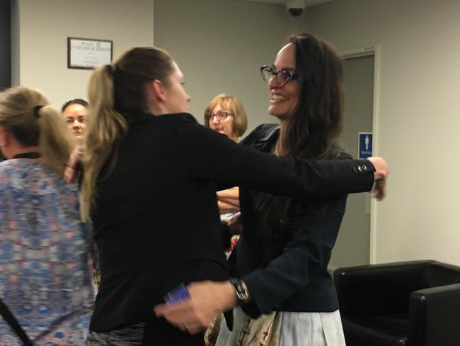 Ousted CEO Sharon Kelsey is hugged by staff on the day she was sacked by Logan City Council