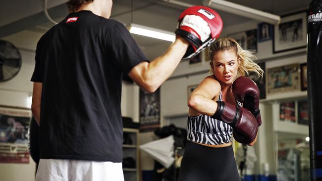 Harry Garside and then-girlfriend working out at Woolloomooloo PCYC when they were together. Picture: Sam Ruttyn<br/>