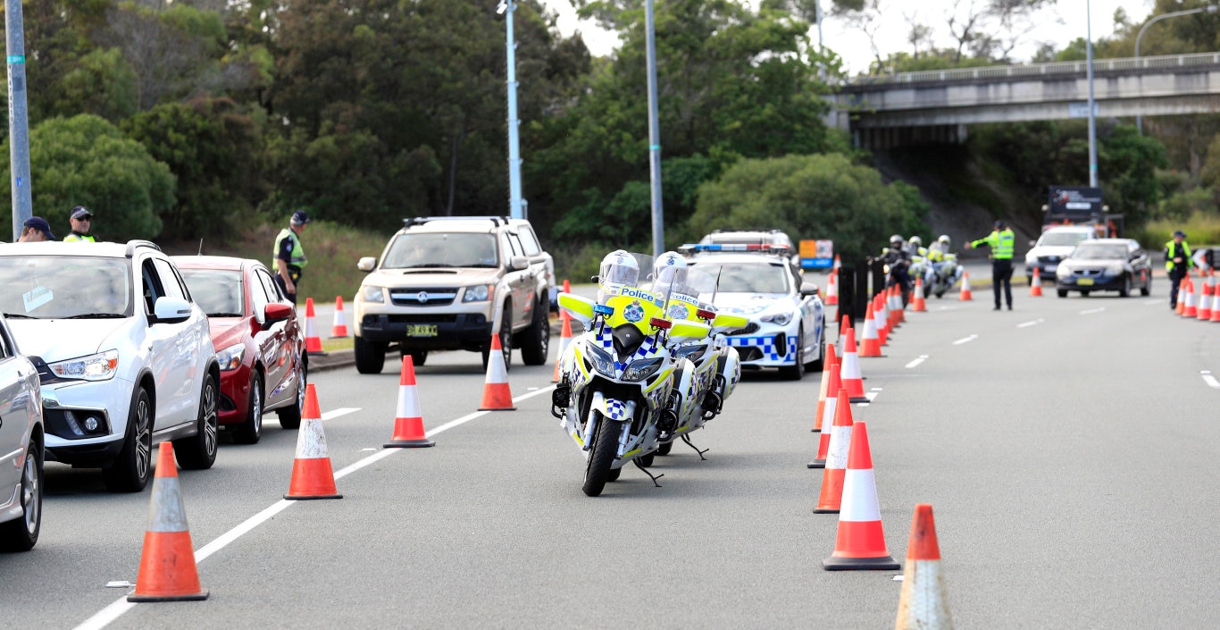 Queensland Police set up a road block due to the Corona Virus at the NSW / Queensland Border on the old Pacific Highway at Coolangatta. Photo: Scott Powick Newscorp