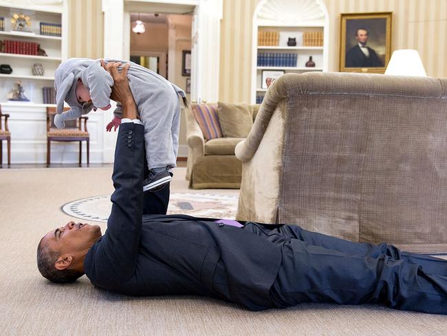 Oct. 30, 2015: Obama lifts young Ella Rhodes, daughter of Deputy National Security Advisor Ben Rhodes, wearing her elephant costume for Halloween. Picture: Official White House Photo by Pete Souza