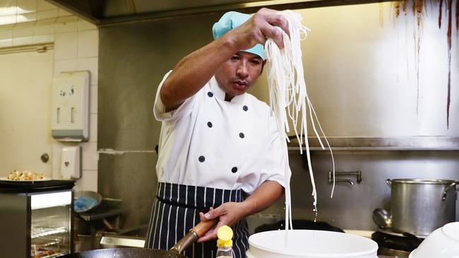 The Best Soup, Best Food restaurant has just opened at the southern end of Lake Street in the Cairns CBD. Owner and chef Kyaw Nyein Chan makes a Kaw Tayout stir fry with chicken. Picture: Brendan Radke