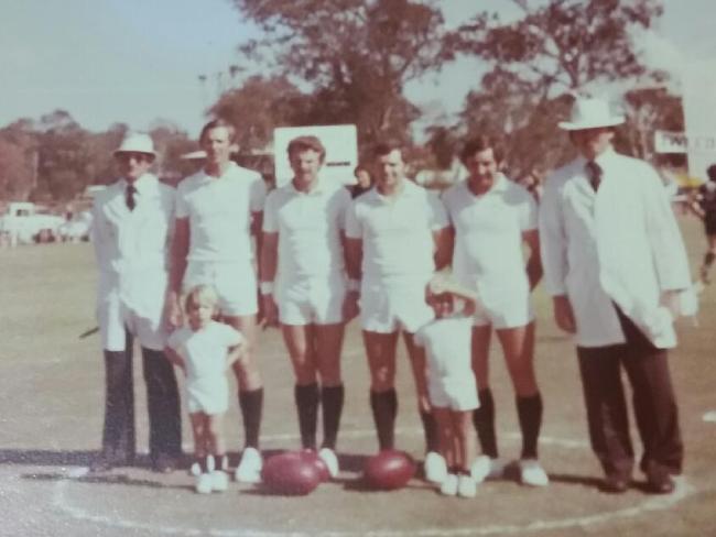 Billy Connell (second from the right) with son Chris Connell in front of him. Picture: Supplied.