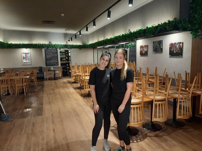 42nd Street Cafe at Tea Tree Plaza . Jade Brusnahan, 17, Jasmine Reich, 19 in the empty cafe today , 23 March 2020 . Picture: Michael McGuire