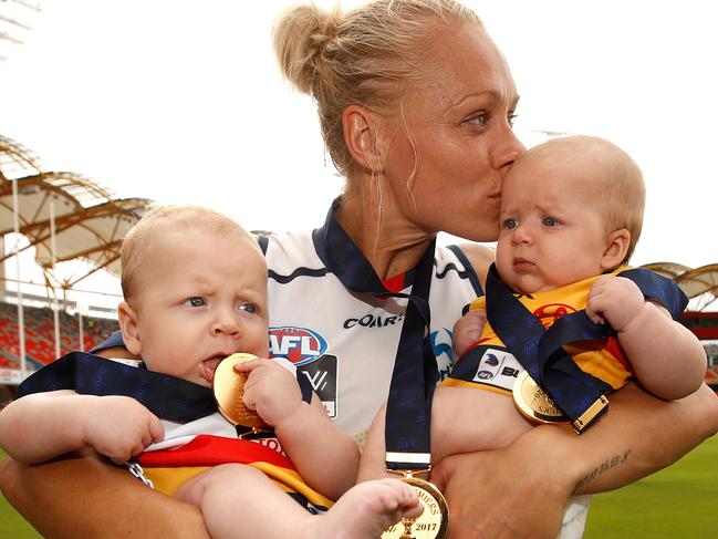 GOLD COAST, AUSTRALIA - MARCH 25: Erin Phillips of the Crows celebrates with children Blake and Brooklyn after the 2017 AFLW Grand Final match between the Brisbane Lions and the Adelaide Crows at Metricon Stadium on March 25, 2017 in Gold Coast, Australia. (Photo by Michael Willson/AFL Media/Getty Images)