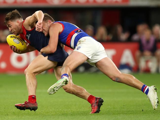 Jack Viney is tackled by Jack Macrae. Picture: Gary Day/AFL Photos via Getty Images