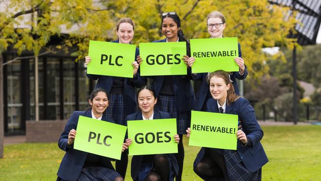 Erin, Phebe, Anna, Hannah, Imashi and Christine celebrate their school’s efforts to go green.