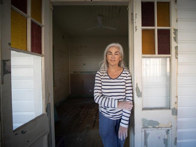 Lismore resident Mackayla Chalmers in her flood damaged home says the town feels “lost and sad.” Picture: Danielle Smith