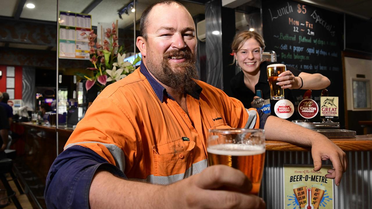 Paul Barnett is served a cheap beer by Ricki-Lee Cole at his local pub, Red Lion Hotel, Elizabeth North. Picture: Bianca De Marchi