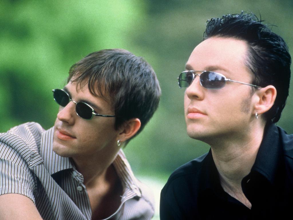 ‘I don’t care what he thinks.’ Darren Hayes, right, has opened up about Savage Garden’s break-up. He is pictured above with former bandmate Daniel Jones, far left.