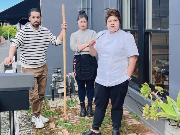 Avtar Saini, his wife Pimrawin Sitthimongkhon and co-owner and head chef Thikumporn Prasitpitiniwat on the empty space where their iconic rickshaw used to sit. Picture: Avtar Saini