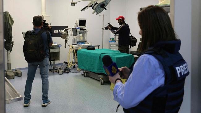 A photo tour origanized by the administration of the Sahel Hospital's on October 22, 2024, shows journalists touring an operating room in the hospital in Beirut's southern suburb of Haret Hreik. Israeli military spokesman Rear Admiral Daniel Hagari referenced a bunker allegedly filled with cash and gold under the Sahel hospital in the southern suburbs of the capital Beirut, but said the vault had not been targeted yet by the Israeli military. Fadi Alameh, who heads the hospital, told AFP that Israel's "allegations are false." He added that medical staff working in the emergency department, the only hospital unit still operating despite the dangers, were being evacuated. (Photo by Anwar AMRO / AFP)