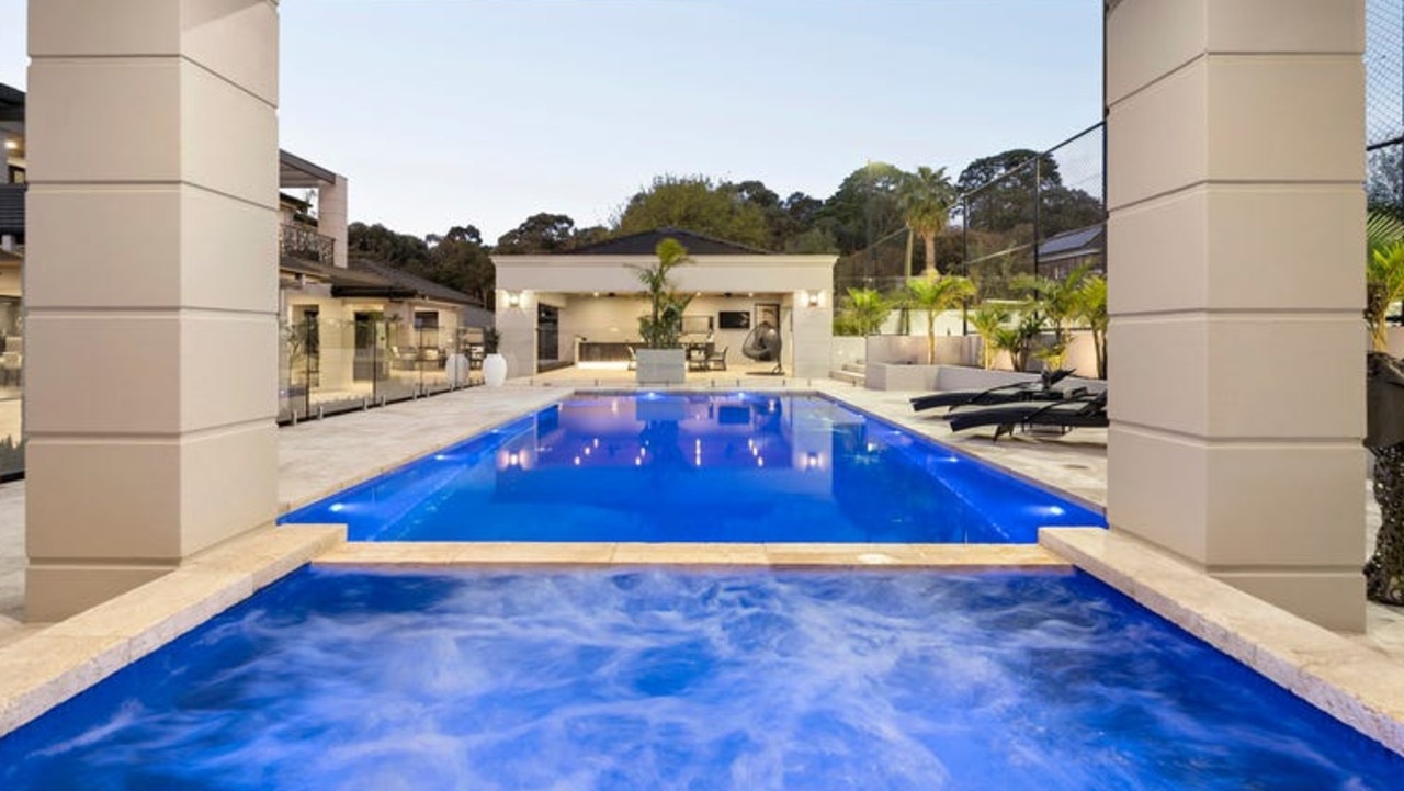 The feature pool and spa in the home’s back yard.