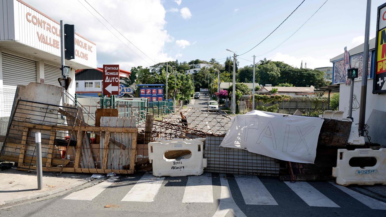 Makeshift roadblocks constructed by rioters have added to the chaos. Picture: Ludovic Marin / POOL / AFP)