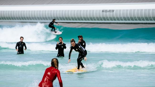 A surfer catching a wave at URBNSURF in Avalon, Melbourne. Picture: Supplied