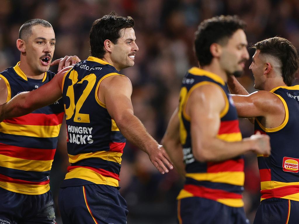 ADELAIDE, AUSTRALIA - MAY 02: dDarcy Fogarty of the Crows celebrates a goal with team mates uring the 2024 AFL Round 08 match between the Adelaide Crows and the Port Adelaide Power at Adelaide Oval on May 02, 2024 in Adelaide, Australia. (Photo by Sarah Reed/AFL Photos via Getty Images)