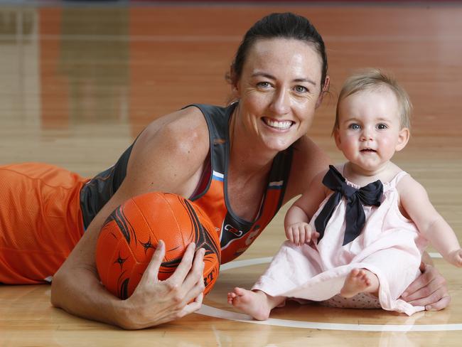 Netballer and new mum Bec Bulley. pictured with daughter Indie, has been enticed back to the game by the Giants.