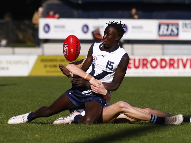 MELBOURNE, AUSTRALIA - JUNE 10: Ben Rongdit of Victoria Country is tackled by Charlie Whitehead of Victoria Metro during the AFL National Development Championships U16 match between Victoria Country and Victoria Metro at Trevor Barker Beach Oval on June 10, 2023 in Melbourne, Australia. (Photo by Daniel Pockett/AFL Photos/via Getty Images)